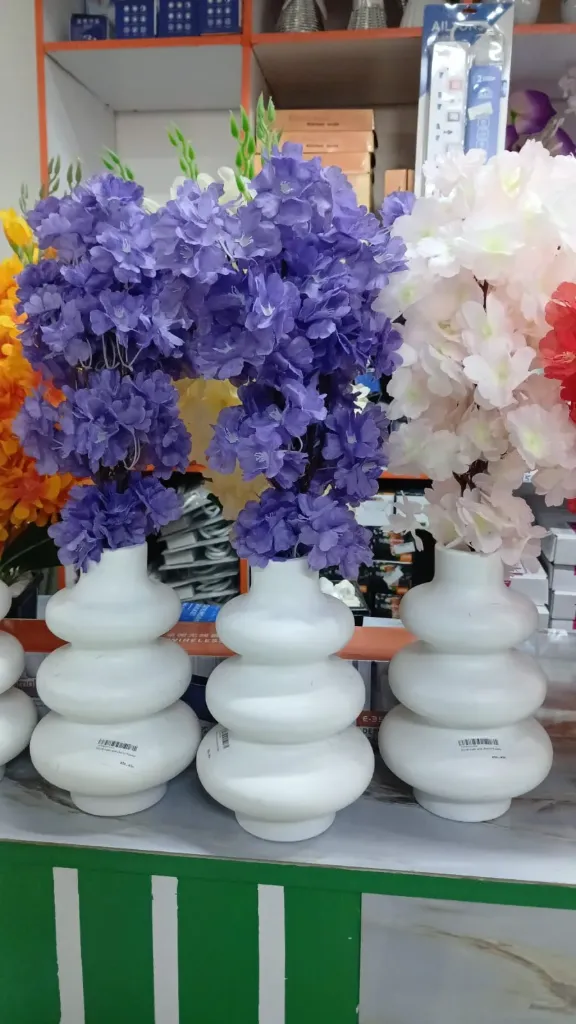 Spiral vase and cherry flower